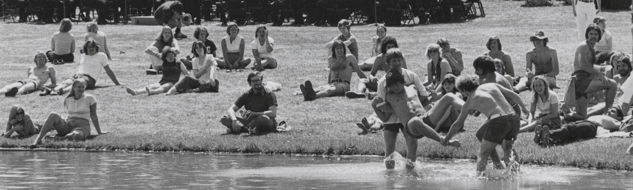 Students playing in the Zumberge Pond.